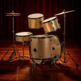 Full size adult 5-piece drum set in champagne from Drum Addict Apparel by Yggdrasils Wood, with drums and cymbals visible.