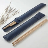 Black Drum Addict Apparel by Yggdrasils Wood drum stick holster, 44x6cm, designed for secure drum stick storage.