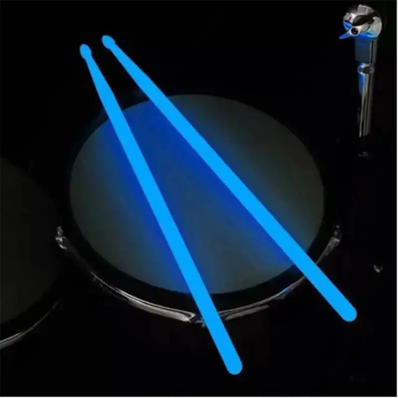 Colorful fluorescent drum sticks from Drum Addict Apparel by Yggdrasils Wood, displayed in vibrant blue with bright accents.