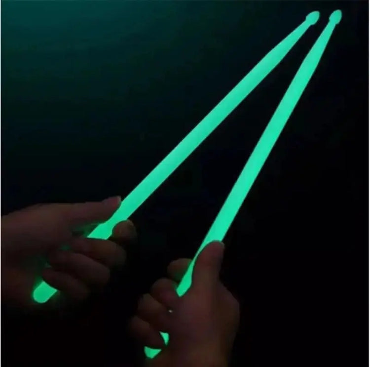 Colorful fluorescent drum sticks from Drum Addict Apparel by Yggdrasils Wood, shown in vibrant blue with bright, eye-catching design.