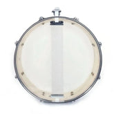 13x3.5 inch professional snare drum by Drum Addict Apparel, featuring a sleek wood finish and durable metal hardware.
