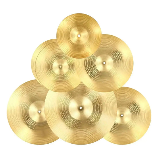 Six bright copper cymbals for drum set from Drum Addict Apparel by Yggdrasils Wood, 6-piece cymbal set for percussion instruments.