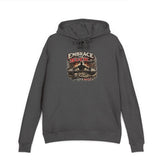 Black unisex hoodie from Printify featuring the "Embrace The Suck" design, shown on a model with a front view.