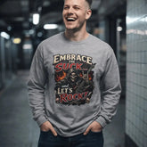 Red long-sleeve tee by Printify featuring "Embrace The Suck" text on the front, casual and comfortable for everyday wear.