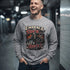 Red long-sleeve tee by Printify featuring "Embrace The Suck" text on the front, casual and comfortable for everyday wear.