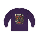 Red long-sleeve tee from Printify with "Embrace The Suck" slogan, made of soft fabric, displayed flat.