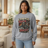 Red long sleeve tee by Printify with "Embrace The Suck" slogan, featuring comfortable fabric and casual fit.