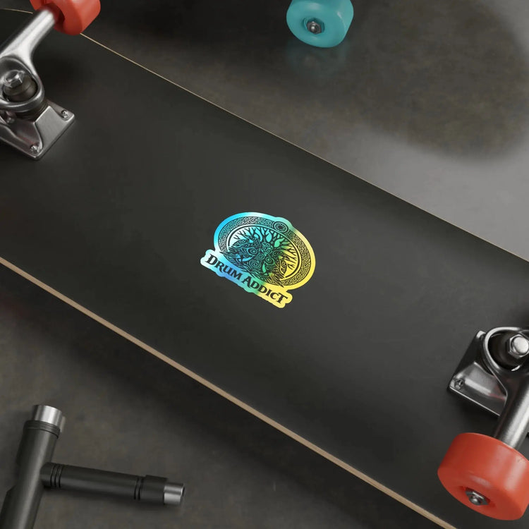 Holographic Drum Addict die-cut sticker featuring a Celtic tree drum design on paper product, vibrant and reflective surface.