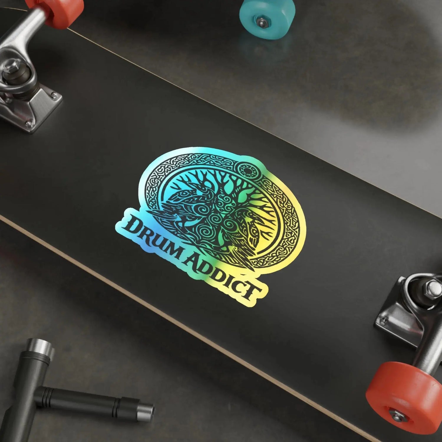 Holographic Drum Addict die-cut sticker featuring a Celtic tree drum design on paper, vibrant holographic finish.